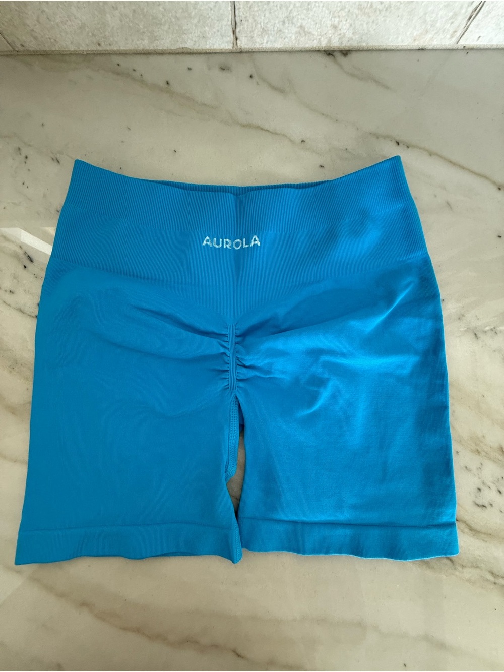 Aurola Women's High-Waist fitness shorts in Bright Blue. Size M
